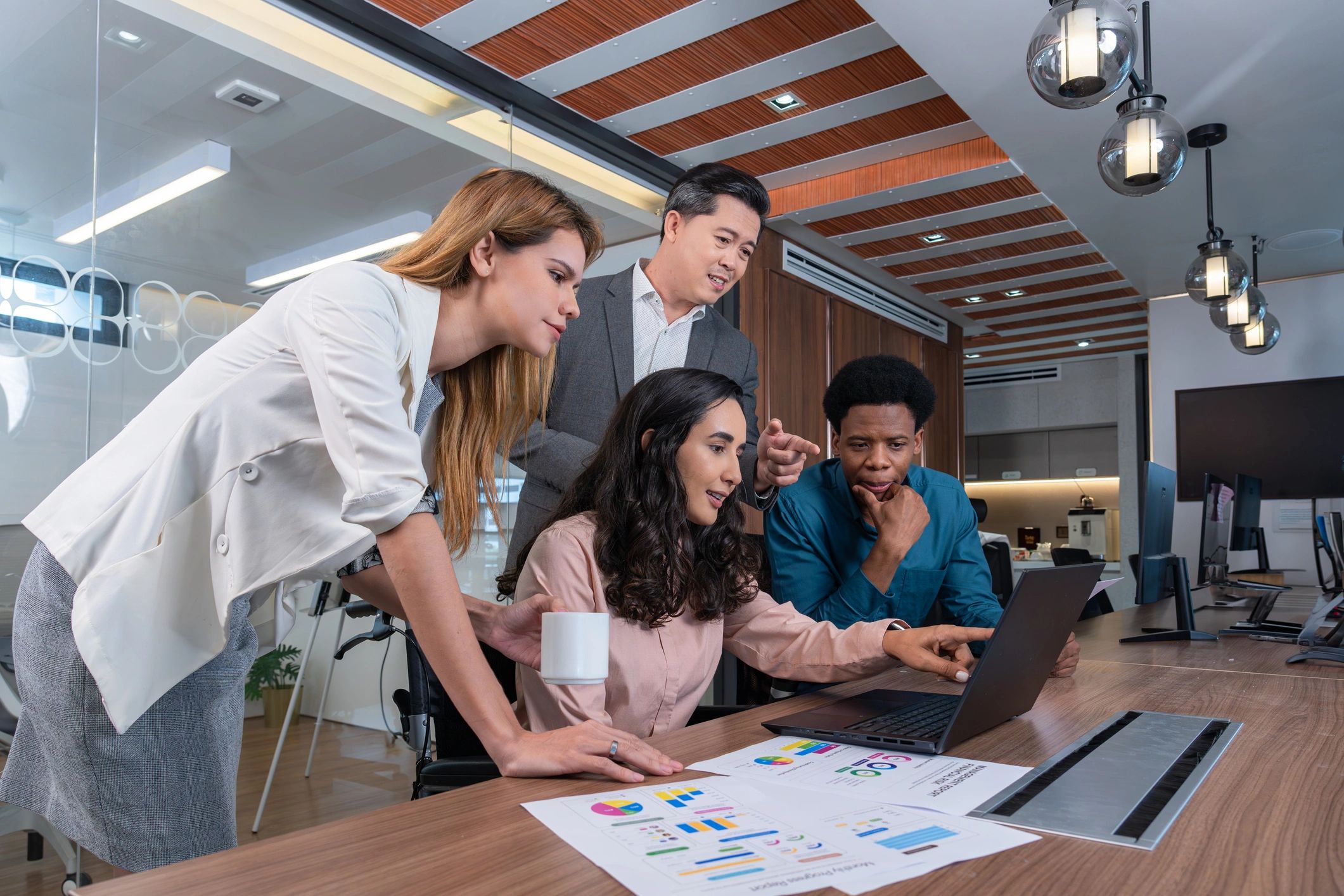 Engineering professionals collaborating in an office